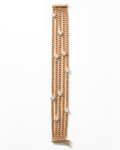 Gold chain bracelet with diamond-like beads on a white background