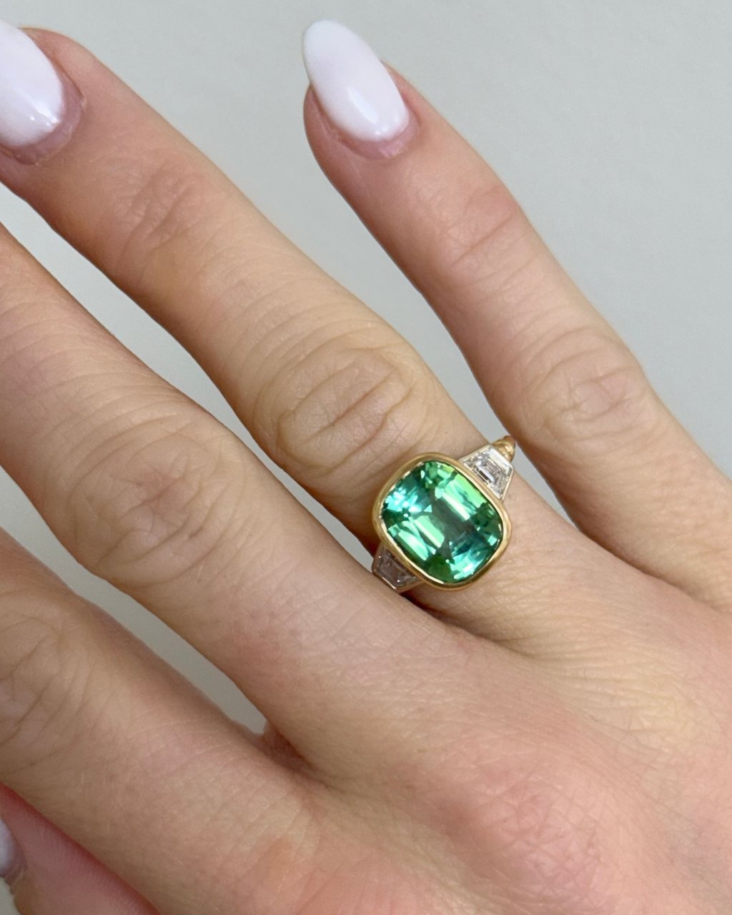 Green tourmaline and diamond ring set in 18K yellow gold