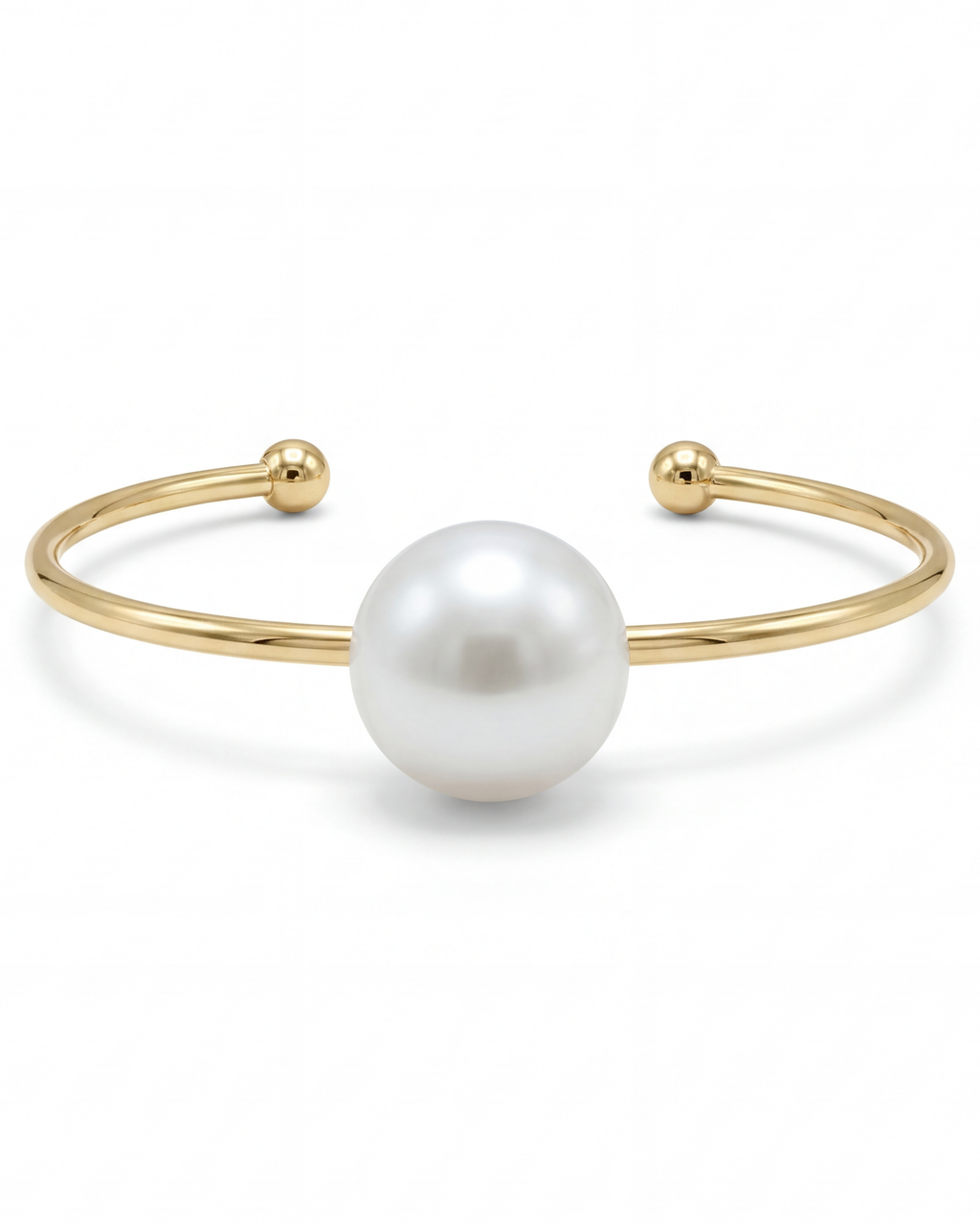 Gold bracelet with a large pearl on a white background