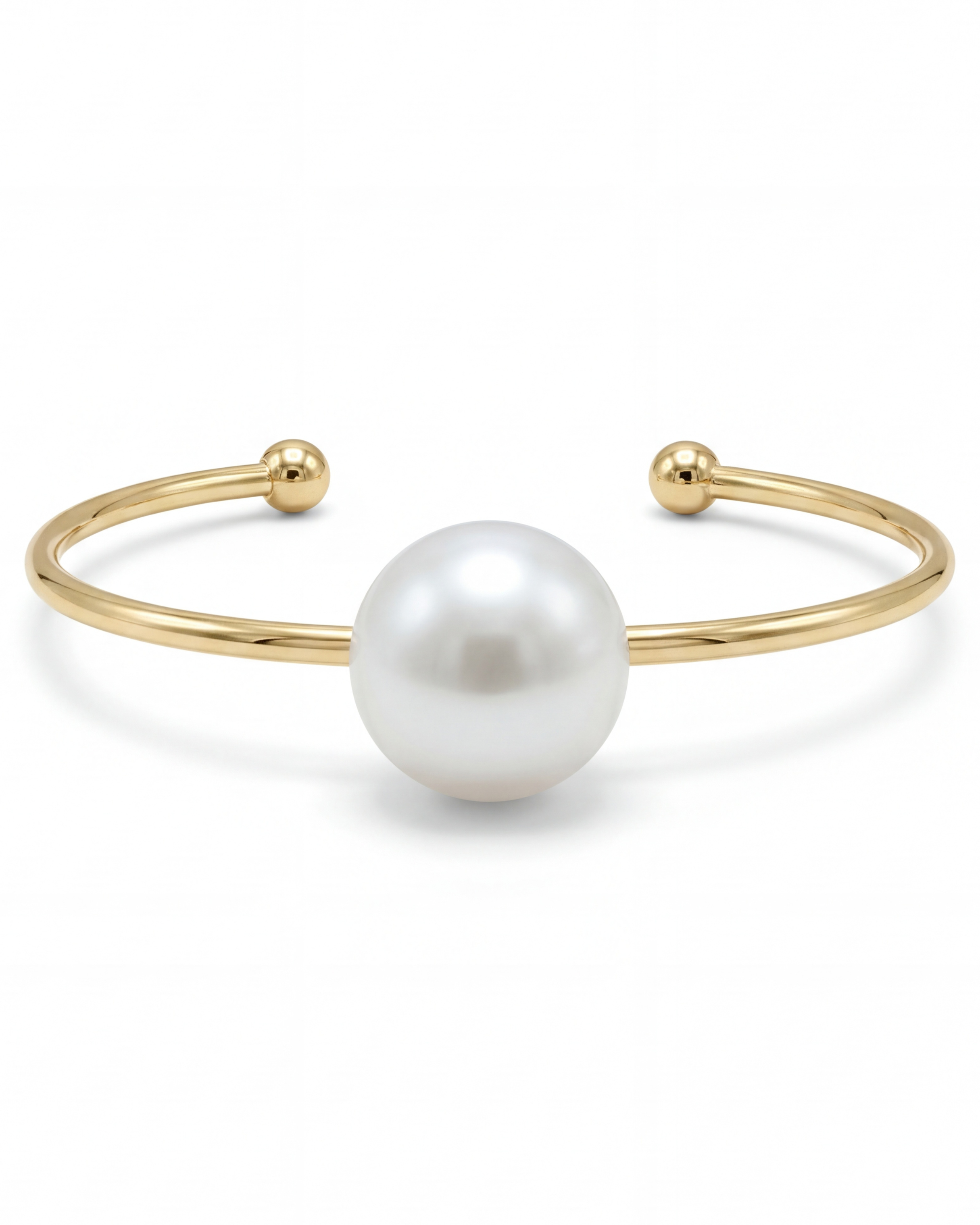Gold bracelet with a large pearl on a white background