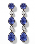 Pair of blue teardrop earrings with diamond accents on a white background